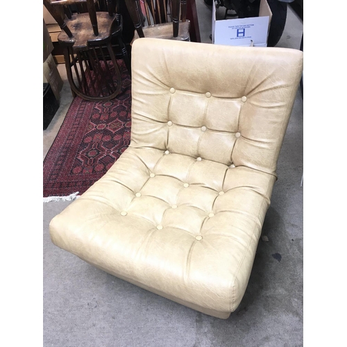 1214 - A button backed 1960/70s leatherette chair, Swedfurn signed. Dimensions approximately 74x64x74cm