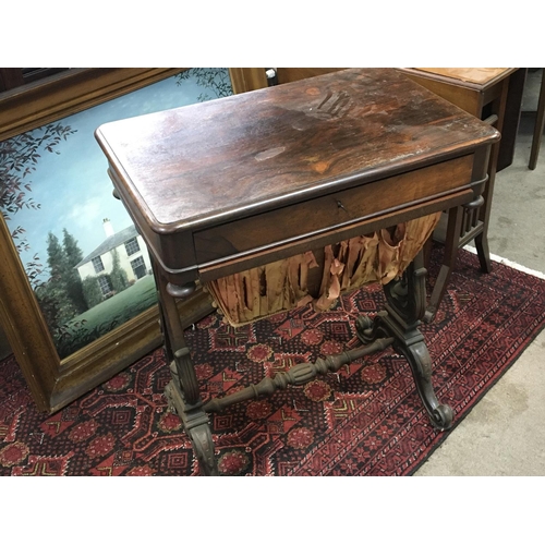 1215 - A pen Early Victorian Rosewood work box with a sliding drawer and wool box on harp shaped supports a... 