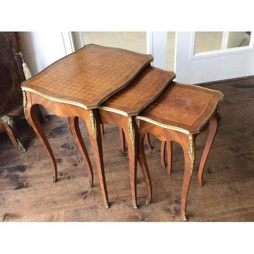 1220 - A Nest of three French Louis XV style walnut and parquetry tables with gilt metal mounts. Sold in si... 