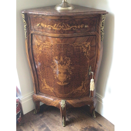 1221 - A French Louis XV style corner cabinet with a marble top above a drawer and shaped cupboards. Sold i... 