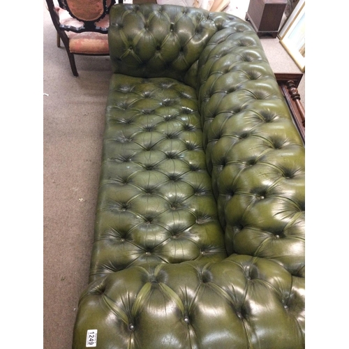 1249 - A green leather chesterfield sofa with button back and seat 198 cm x 90 cm .