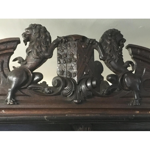 1265 - A large oak Sideboard profusely carved With figures, animals,fruit and foliage the raised back with ... 