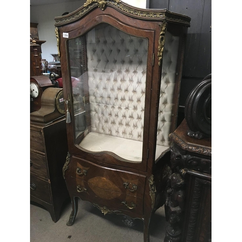 1266 - A French style display cabinet with gilt mounts the single door enclosing selfs above two Drawers.