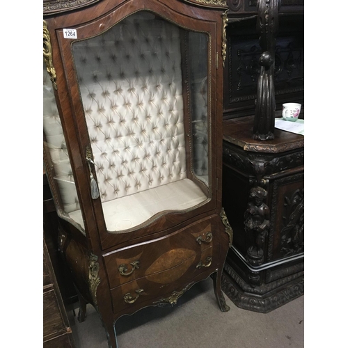 1266 - A French style display cabinet with gilt mounts the single door enclosing selfs above two Drawers.