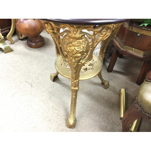 1273 - A Victorian cast metal gilt pub table. 58cm diameter 70cm tall.