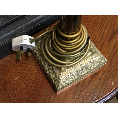 1279 - A brass table lamp. 65cm to top of the bulb.