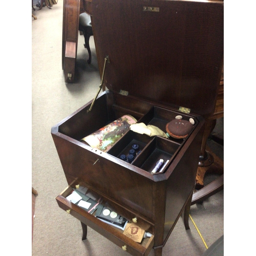 1283 - A Mahogany work box with a hinged lid above two drawers sold with contents. Hight 69cm