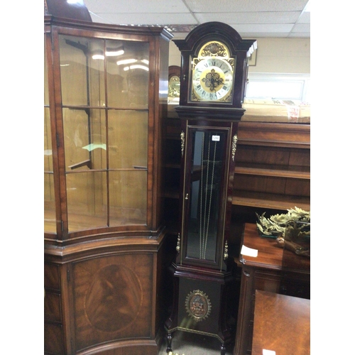 1290 - A Continental 20th century Mahogany longcase clock with gilt metal mounts pendulum and three weights... 