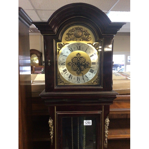 1290 - A Continental 20th century Mahogany longcase clock with gilt metal mounts pendulum and three weights... 