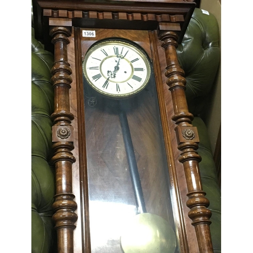 1306 - A walnut case double weight wall clock with visible pendulum and two other wall clocks .