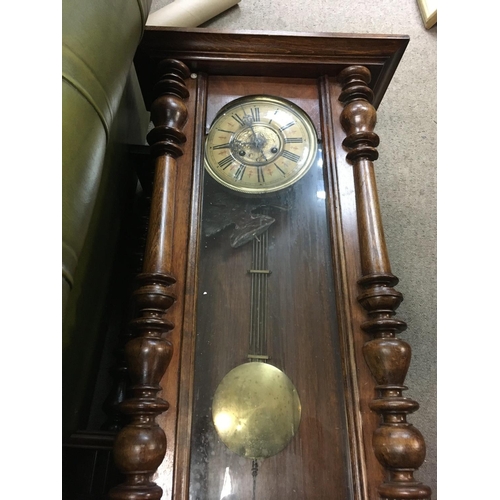 1306 - A walnut case double weight wall clock with visible pendulum and two other wall clocks .