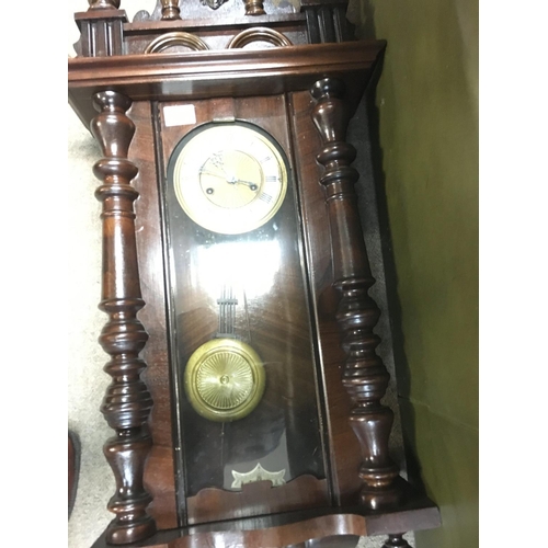 1306 - A walnut case double weight wall clock with visible pendulum and two other wall clocks .