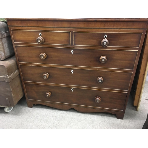 1326 - A Georgian mahogany chest of drawers fitted with two short and three Long drawers on bracket feet .