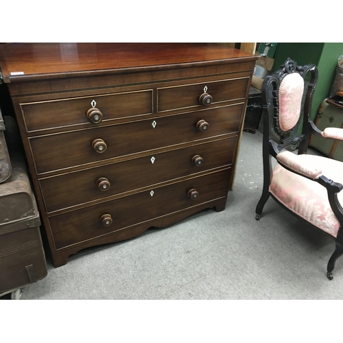 1326 - A Georgian mahogany chest of drawers fitted with two short and three Long drawers on bracket feet .