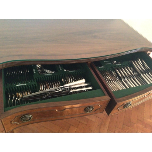 1329 - A Mahogany two drawer table with a fitted silver plate canteen of cutlery maker Walker Hall Sheffiel... 