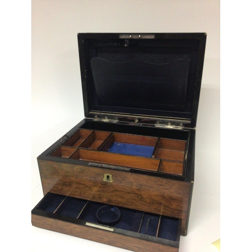 1330 - A quality late Victorian rosewood travelling box with a well fitted interior and sprung loaded jewel... 