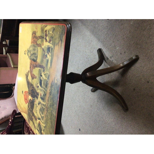 1344 - A Mahogany occasional table the top with an image of a hunt.