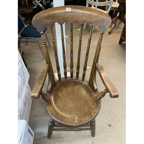 1354 - A large spindle back Windsor armchair.