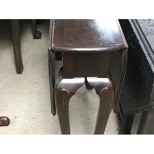 1361 - A mahogany drop leaf table. 66cm wide