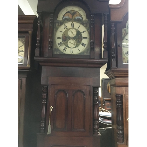 1364 - A Victorian mahogany long case clock the Arched painted dial with moon roller second subsidiarie dia... 