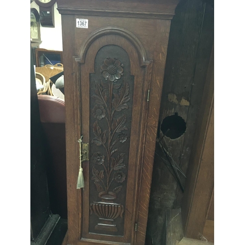 1367 - A oak carved long case clock the arched brass dial with Roman numerals.