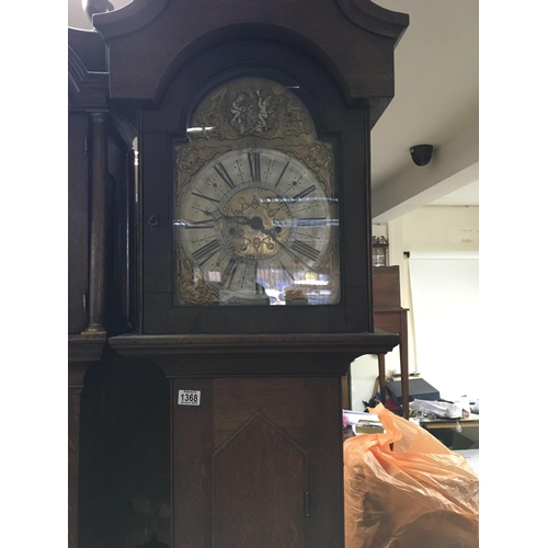 1368 - A oak 8 day long case clock the arched brass dial with Roman numerals. No reserve.