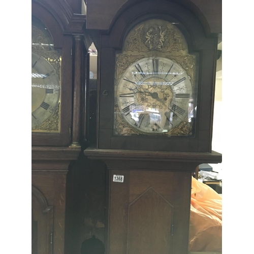 1368 - A oak 8 day long case clock the arched brass dial with Roman numerals. No reserve.