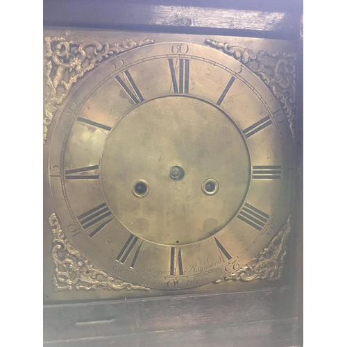 1369 - A oak long case clock the brass dial with Roman numerals no reserve.