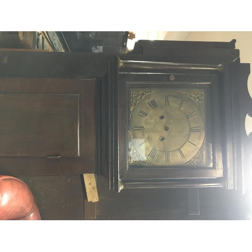 1369 - A oak long case clock the brass dial with Roman numerals no reserve.