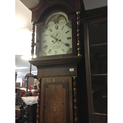 1370 - A oak long case clock the arched panted dial with moon roller Roman numerals and second dial .