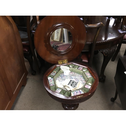 1382 - A circular mahogany sewing box. 70cm tall and 53cm diameter