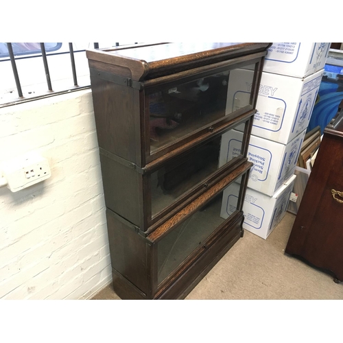 1390 - A globe wernicke three section bookcase. 86 cm wide 124 cm tall.