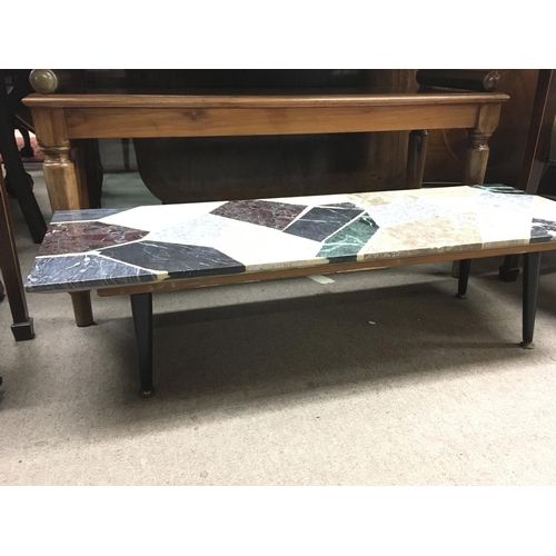 1396 - A marble top mid 20th century design coffee table. 105cm by 38cm