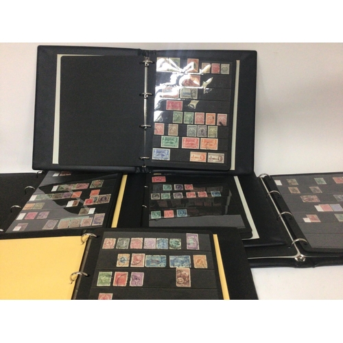 1721 - Five blue Alpha Stamp Albums containing British colonial and Empire stamps from Queen Victoria to El... 