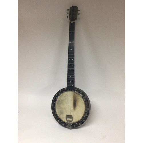 1975 - A vintage banjo with enclosed back with a case