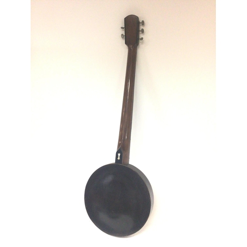1975 - A vintage banjo with enclosed back with a case
