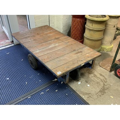 1987 - An industrial flat bed trolley, 122cm x 68cm