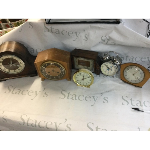 1995 - A collection of clocks including mantle clocks and alarm clocks.