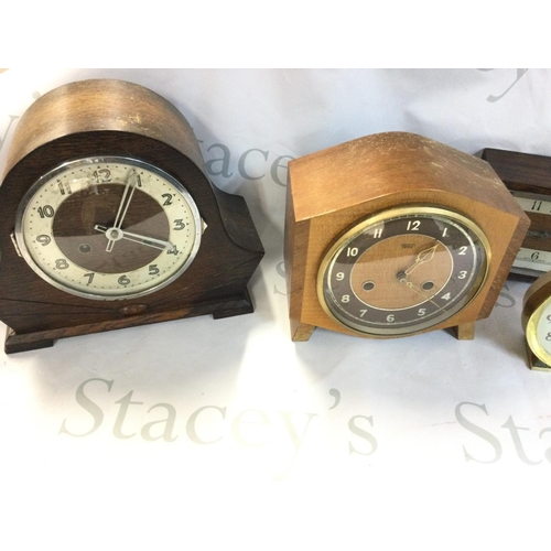 1995 - A collection of clocks including mantle clocks and alarm clocks.