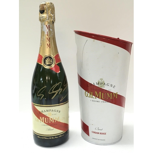 2006 - A bottle of G.H Mumm champagne signed by Michael Schumacher, former German Formula One racer. This l... 