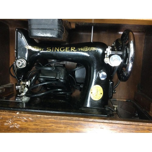 Two cased vintage Singer sewing machines. This lot cannot be posted