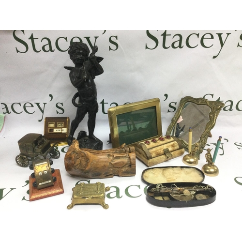 808 - A collection of oddments comprising a bronzed figure of a cherub, brass desk items, scales and weigh... 