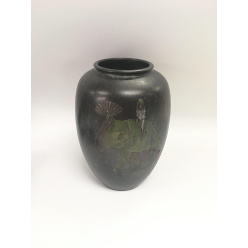 823 - A bronze signed vase