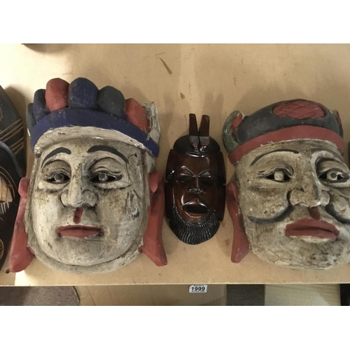 842 - Five carved masks.