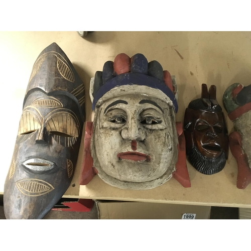 842 - Five carved masks.