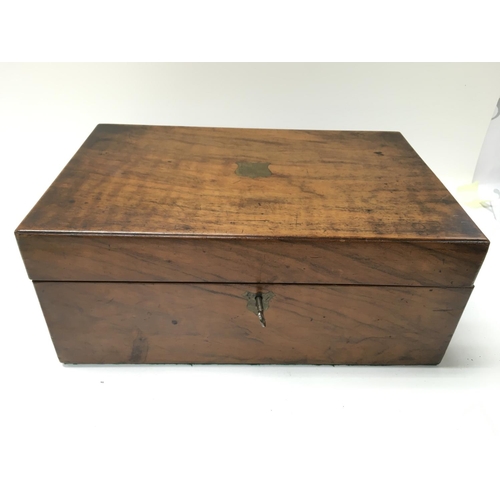 851 - A walnut writing box with key. Postage B 35 x 23 x 14cm