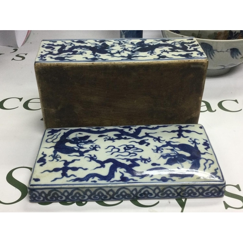 919 - A box of Oriental ceramics comprising a blue and white box, bowls, plates etc. Shipping category D.