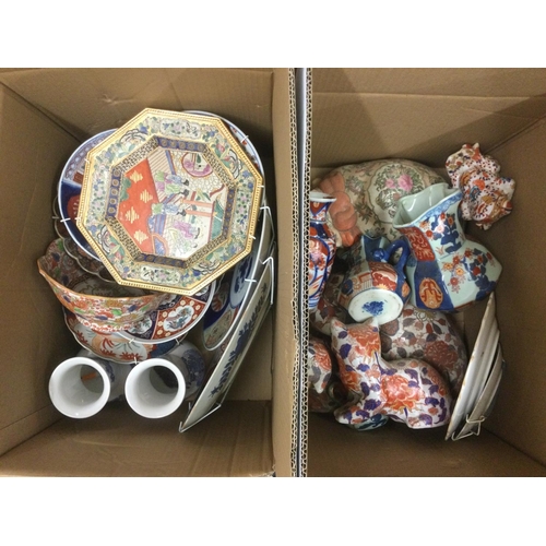 940 - Two boxes of Oriental ceramics comprising mainly modern imari figures of animals, dishes etc. Shippi... 