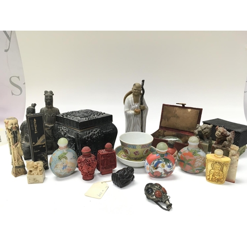 942 - A collection of Chinese items including Snuff bottles, a Japanese wooden Netsuki of a monkey in the ... 