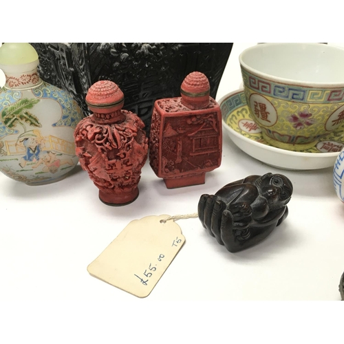 942 - A collection of Chinese items including Snuff bottles, a Japanese wooden Netsuki of a monkey in the ... 